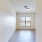 a room with wood floors and a window
