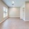 a room with a wood floor and a bathroom