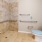 a bathroom with a toilet and shower