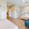 a bedroom with a bed and couch