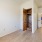 a room with a wood floor and a closet