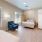 a bedroom with a bed and a chair